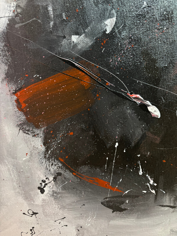 Close-up detail of an abstract painting featuring layered black and gray textures, a bold rust-orange brushstroke, scattered paint splatters, and a raised line of thick paint crossing the surface.