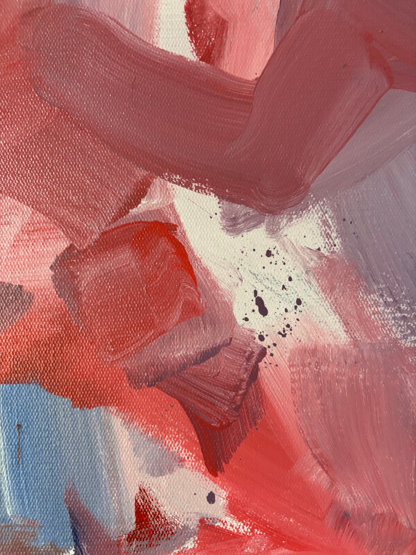 Detail of a gestural abstract painting with broad pink and coral brushstrokes, mauve layers, black splatter marks, and visible canvas grain.